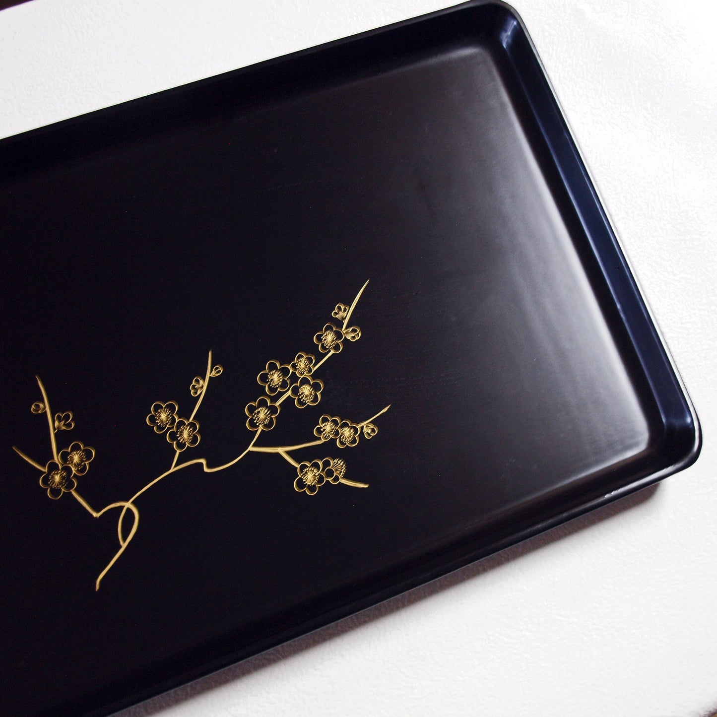 Tray, wooden long tray with gold-painted plum blossom design, black lacquer, warped